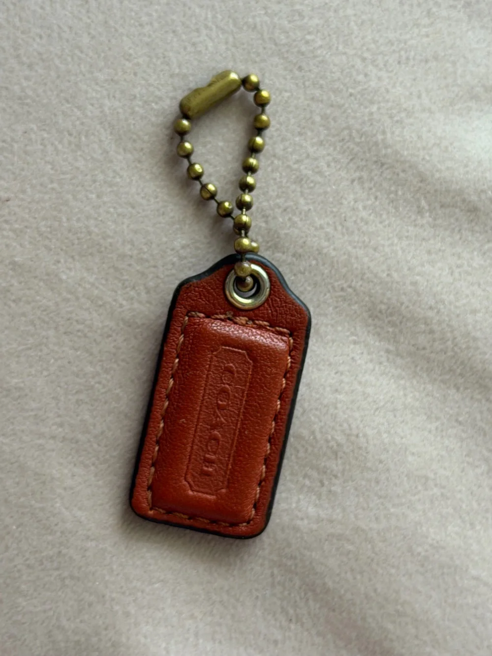 COACH Small Orange Leather Hangtag🧡